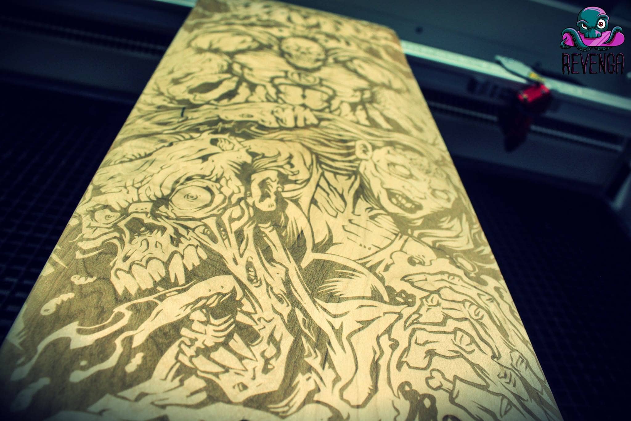 Laser-engraved skateboard design of a team of zombie superheroes