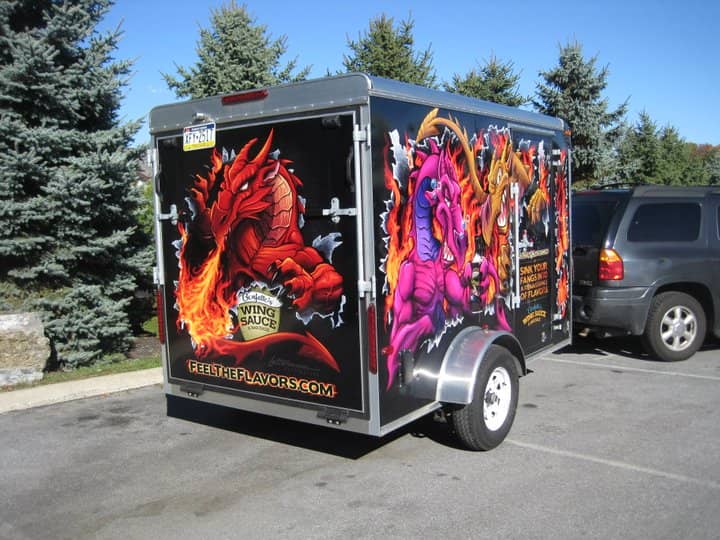 Trailer wrap decal graphics with dragons