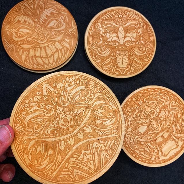 I had these tiki coasters made from my art last year from a laser engraver. I’m at a convention and close to getting rid of the last of the batch. Should I reprint these or come up with new designs? Any ideas of a new theme?#tikiartist #tiki #woodart #beachart