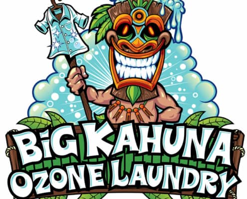 A tiki man holding a staff showing off his clean laundry surrounded by bubbles and tropical leaves.