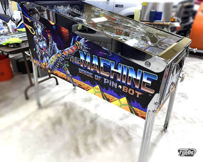 Bride of Pinbot Vinyl wrap for Pinball Machines artwork by Brian Allen. An illsutration of an outerspace drawing with a large woman robot with astroids, and planeits.
