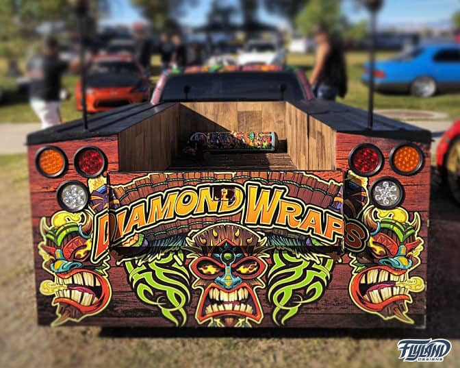 A vehicle wrap showcasing many different tropical tiki characters. The text reads "Diamond Wraps"
