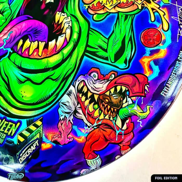 Tribute illustration of Slimer, StayPuft Marshmallow Man, and other ghosts from the Ghostbusters cartoon printed on a Disc Golf Disc