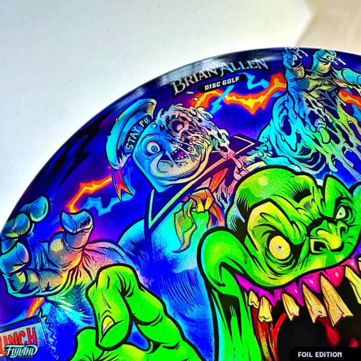 Tribute illustration of Slimer, StayPuft Marshmallow Man, and other ghosts from the Ghostbusters cartoon printed on a Disc Golf Disc