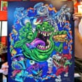 Cartoon parody illustration of Slimer, Stay Puft Marshmallow Man, and other ghots from the Ghostbusters cartoon drawn by Artist Brian Allen