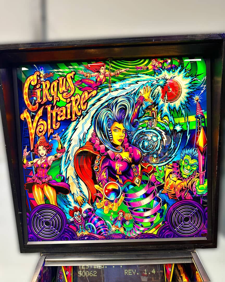 Illustration for the Cirqus Voltaire Pinball machine showing brighly colored circus performers, clowns, acrobats, and a ringleader drawn by Brian Allen