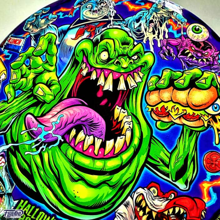 Tribute illustration of Slimer, StayPuft Marshmallow Man, and other ghosts from the Ghostbusters cartoon printed on a Disc Golf Disc