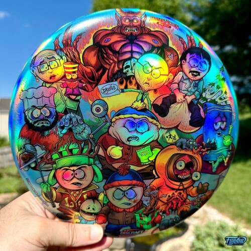 Drawing of the South Park characters in a darker style drawn by Brian Allen including Stan, Cartman, Kenny, Kyle, Chef, Satan, Terrance and Phillip, Randy, Mr. Garrison, Mr. Mackey, and more printed on a SuperColor Discraft Buzzz