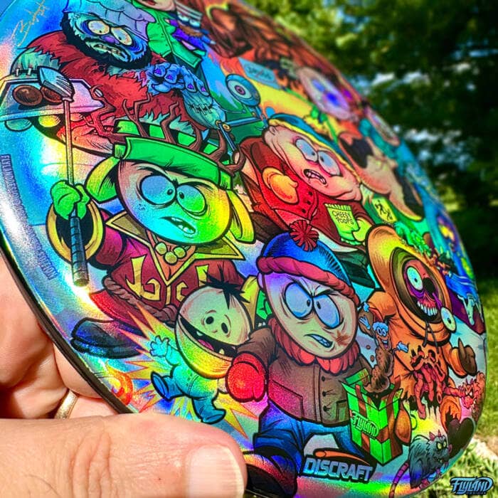 Drawing of the South Park characters in a darker style drawn by Brian Allen including Stan, Cartman, Kenny, Kyle, Chef, Satan, Terrance and Phillip, Randy, Mr. Garrison, Mr. Mackey, and more printed on a SuperColor Discraft Buzzz