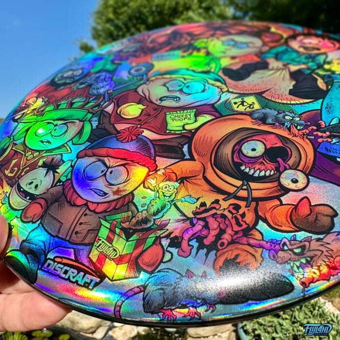Drawing of the South Park characters in a darker style drawn by Brian Allen including Stan, Cartman, Kenny, Kyle, Chef, Satan, Terrance and Phillip, Randy, Mr. Garrison, Mr. Mackey, and more printed on a SuperColor Discraft Buzzz