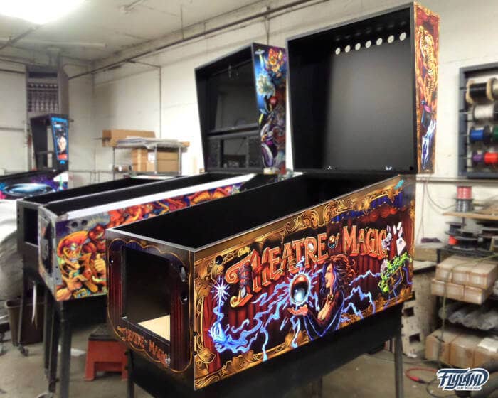 Theather of Magic Vinyl wrap for Pinball Machines artwork by Brian Allen. A magical illsutration with a woman holding a magic ball,. there are playing cards trunks with chains and wrabbis coming out of hats.