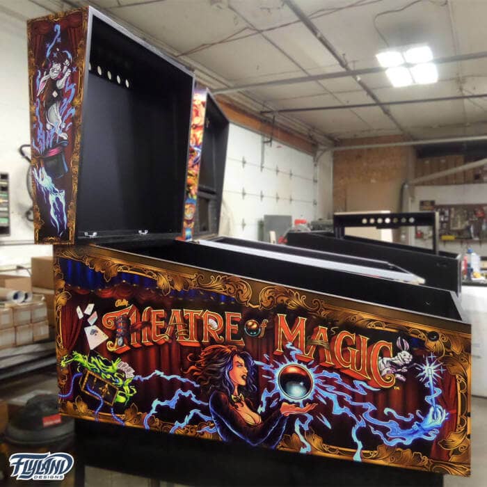 Theather of Magic Vinyl wrap for Pinball Machines artwork by Brian Allen. A magical illsutration with a woman holding a magic ball,. there are playing cards trunks with chains and wrabbis coming out of hats.