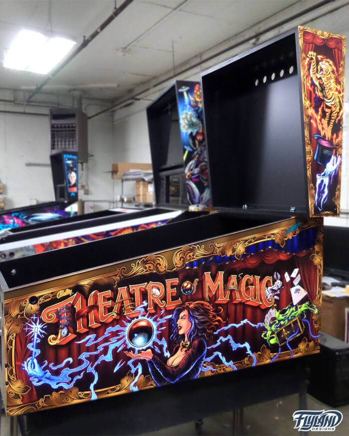 Theather of Magic Vinyl wrap for Pinball Machines artwork by Brian Allen. A magical illsutration with a woman holding a magic ball,. there are playing cards trunks with chains and wrabbis coming out of hats.