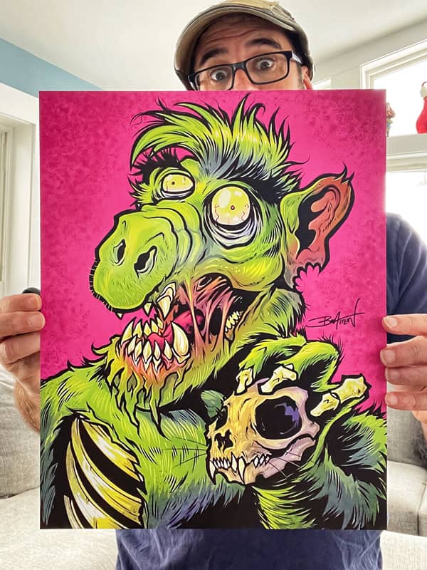 An illustration of a green Zombie Alf holding the skull of a cat